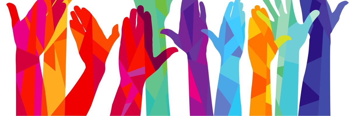 many-coloured hands raised